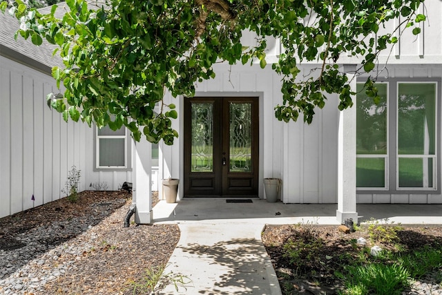 29 Westwood Dr W, Trinity, TX 75862 - property entrance with french doors and board and batten siding