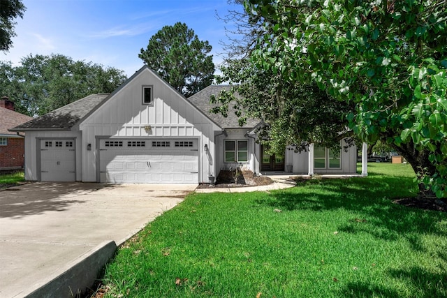 29 Westwood Dr W, Trinity, TX 75862 - view of front of property featuring an attached garage, a front lawn, board and batten siding, roof with shingles, and concrete driveway