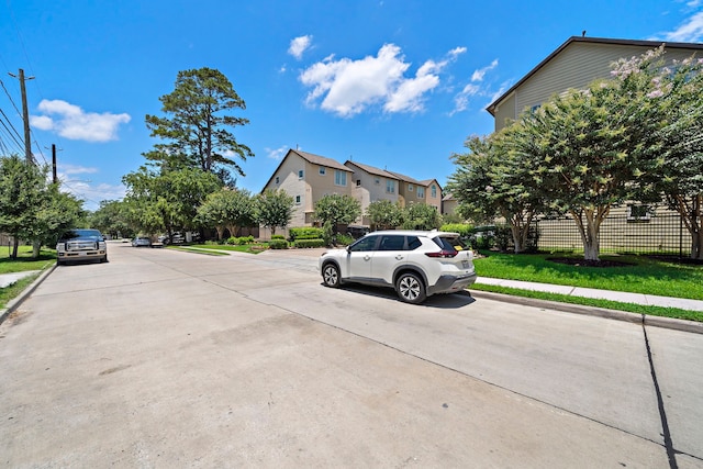 878 Fisher St, Houston, TX 77018 - view of concrete road with sidewalks, curbs, and a residential view
