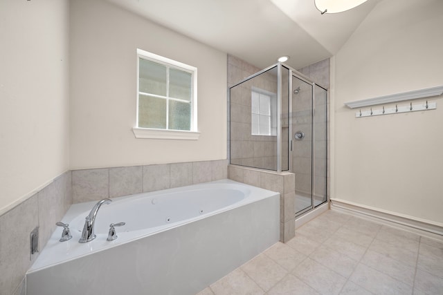 878 Fisher St, Houston, TX 77018 - bathroom featuring a shower stall, a bath, and tile patterned flooring