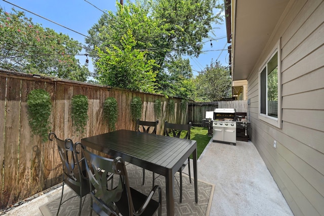 878 Fisher St, Houston, TX 77018 - fenced backyard with a patio, outdoor dining space, and a grill
