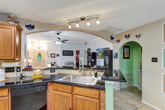 394 Sherandoe Ln, Alvin, TX 77511 - kitchen with black dishwasher, radiator, a ceiling fan, dark countertops, and light tile patterned floors