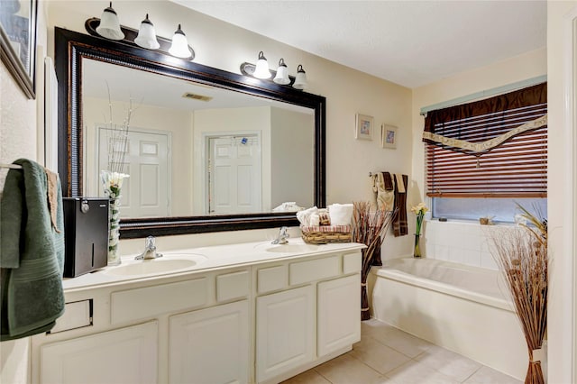 394 Sherandoe Ln, Alvin, TX 77511 - bathroom featuring double vanity, tile patterned floors, and a bath