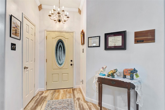 394 Sherandoe Ln, Alvin, TX 77511 - foyer featuring a chandelier, light wood-type flooring, and crown molding