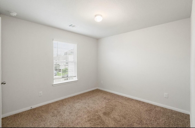 17531 Cuthbert St, Humble, TX 77346 - carpeted spare room with baseboards and a smoke detector