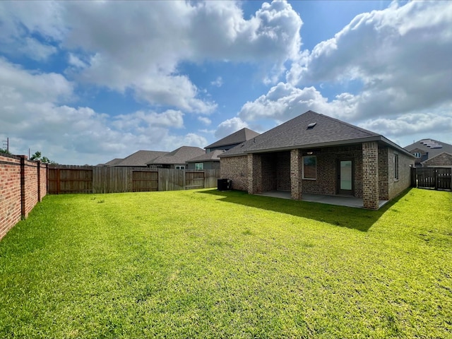 3032 Myrtle Sunset Dr, Katy, TX 77493 - back of property featuring a patio area, brick siding, a fenced backyard, and roof with shingles
