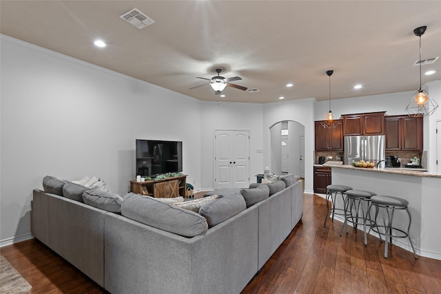 4202 Carnes Ct S, College Station, TX 77845 - living room with arched walkways, ceiling fan, dark wood-style flooring, and recessed lighting