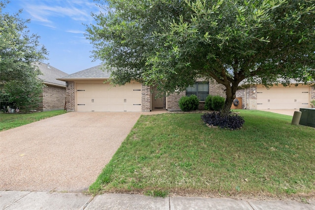 4202 Carnes Ct S, College Station, TX 77845 - obstructed view of property featuring brick siding, driveway, a garage, and a front yard