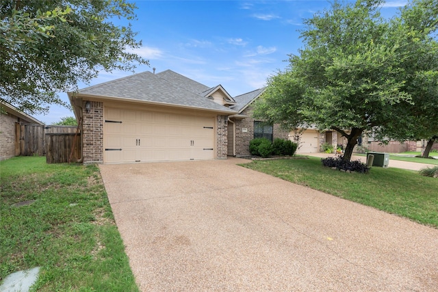 4202 Carnes Ct S, College Station, TX 77845 - ranch-style home featuring brick siding, driveway, a garage, and roof with shingles