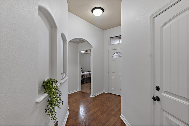 4202 Carnes Ct S, College Station, TX 77845 - foyer featuring arched walkways and dark wood finished floors