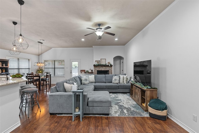 4202 Carnes Ct S, College Station, TX 77845 - living room with a fireplace, ceiling fan, dark wood finished floors, and lofted ceiling