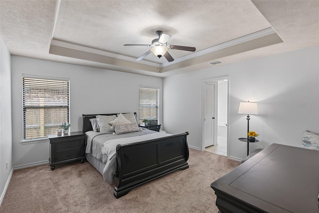 4202 Carnes Ct S, College Station, TX 77845 - bedroom with a tray ceiling, crown molding, light colored carpet, a textured ceiling, and ceiling fan