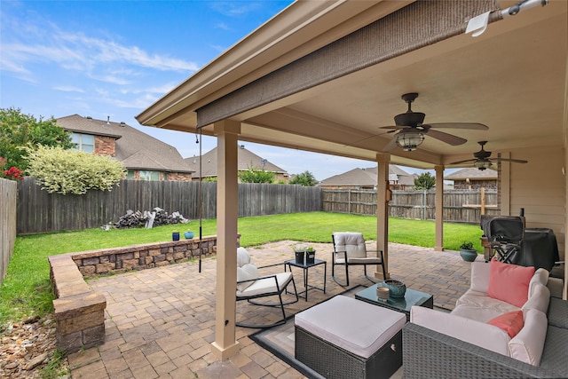 4202 Carnes Ct S, College Station, TX 77845 - fenced backyard with a patio, outdoor lounge area, and a ceiling fan
