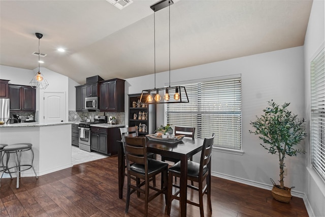 4202 Carnes Ct S, College Station, TX 77845 - dining room with lofted ceiling, hardwood / wood-style flooring, and plenty of natural light