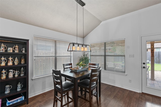 4202 Carnes Ct S, College Station, TX 77845 - dining room featuring a chandelier, vaulted ceiling, and dark wood finished floors
