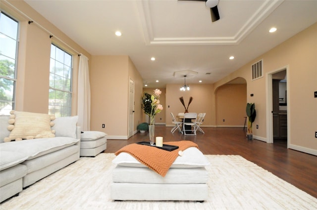 2713 Druid St, Houston, TX 77091 - living room featuring wood finished floors, recessed lighting, a raised ceiling, a ceiling fan, and arched walkways