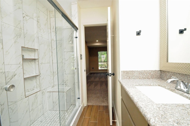 2713 Druid St, Houston, TX 77091 - full bathroom featuring a marble finish shower, wood tiled floors, and vanity
