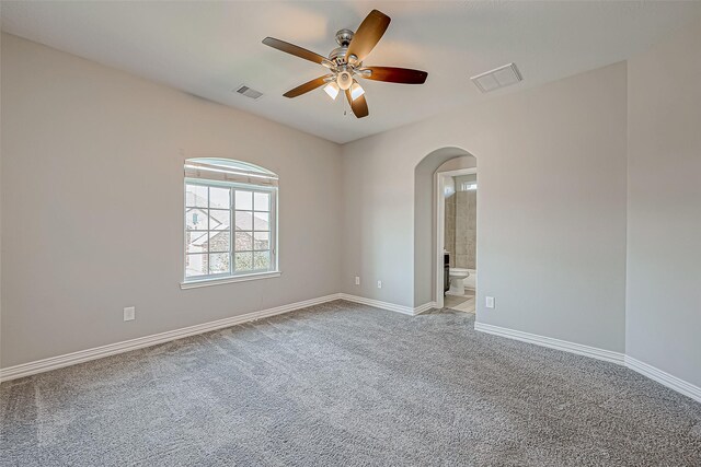 30806 Academy Trace Dr, Spring, TX 77386 - carpeted empty room featuring arched walkways and a ceiling fan