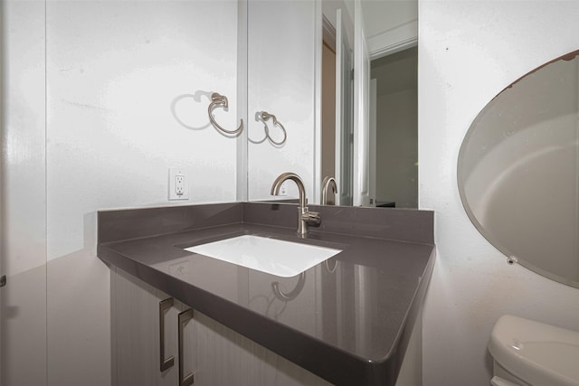 2401 Crawford St Unit C2A, Houston, TX 77004 - half bathroom featuring vanity and toilet