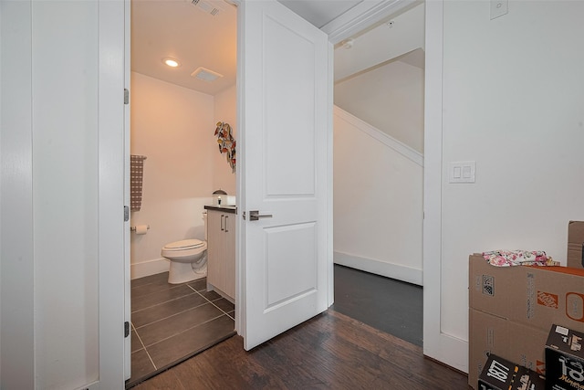 2401 Crawford St Unit C2A, Houston, TX 77004 - bathroom featuring toilet and wood finished floors