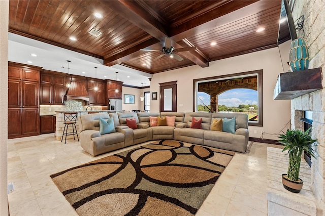 2830 Airport Rd, Brenham, TX 77833 - living room with a wooden ceiling with exposed beams, recessed lighting, light tile patterned floors, a ceiling fan, and a stone fireplace