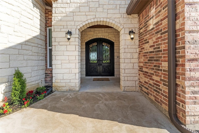 2830 Airport Rd, Brenham, TX 77833 - view of exterior entry with brick siding and french doors