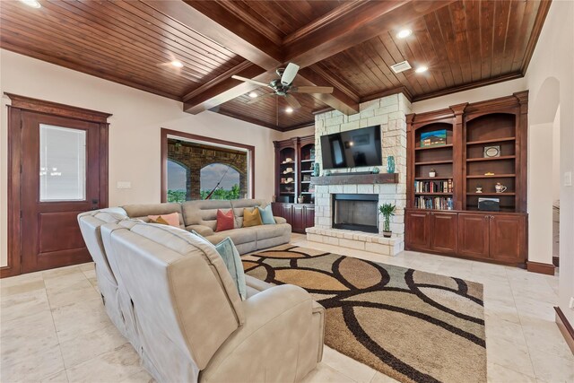 2830 Airport Rd, Brenham, TX 77833 - living area with a wood ceiling with exposed beams, recessed lighting, a stone fireplace, a ceiling fan, and light tile patterned flooring