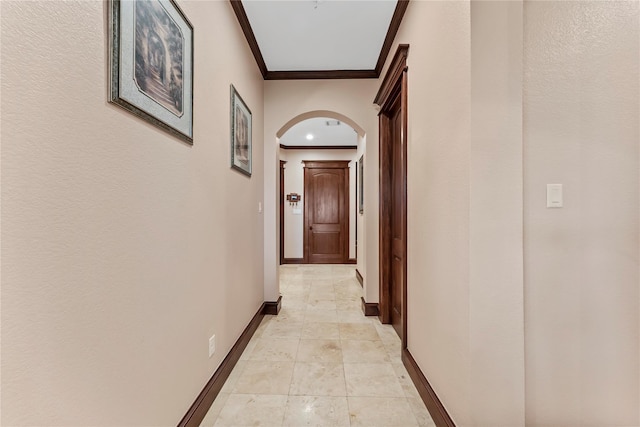 2830 Airport Rd, Brenham, TX 77833 - hallway featuring arched walkways, ornamental molding, and light tile patterned floors