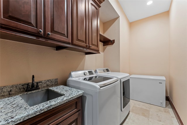 2830 Airport Rd, Brenham, TX 77833 - laundry room with washing machine and clothes dryer and cabinet space