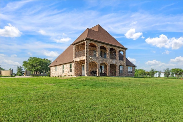 2830 Airport Rd, Brenham, TX 77833 - french country inspired facade featuring a front lawn, brick siding, and a shingled roof