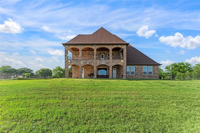 2830 Airport Rd, Brenham, TX 77833 - french country inspired facade featuring a front lawn, a balcony, and brick siding