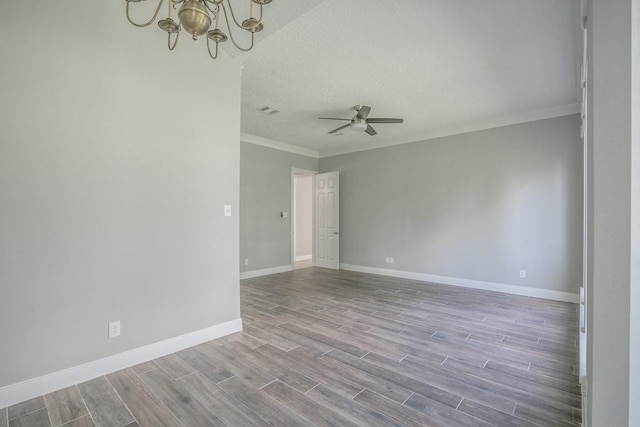 6302 Laver Love Dr, Spring, TX 77379 - spare room featuring crown molding, a chandelier, wood finished floors, a ceiling fan, and a textured ceiling