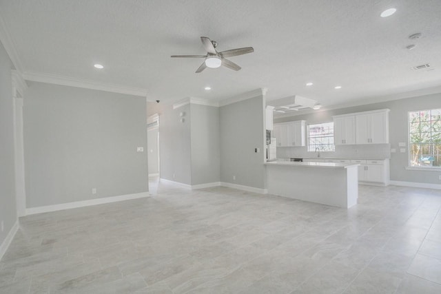 6302 Laver Love Dr, Spring, TX 77379 - unfurnished living room with crown molding, a ceiling fan, plenty of natural light, and recessed lighting
