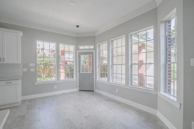 6302 Laver Love Dr, Spring, TX 77379 - unfurnished sunroom with plenty of natural light, a textured ceiling, and crown molding