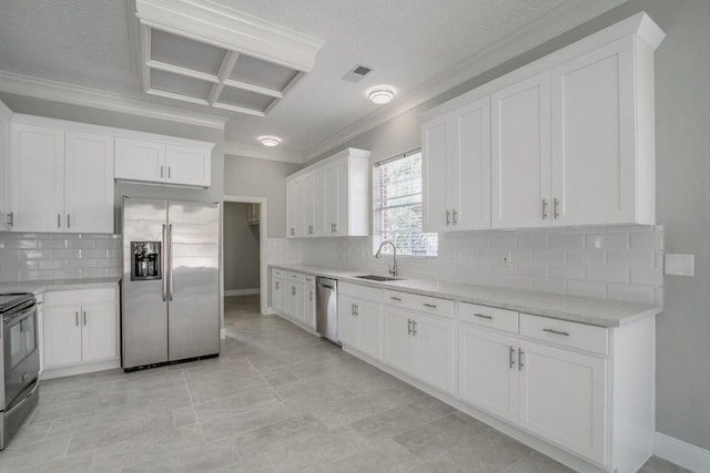 6302 Laver Love Dr, Spring, TX 77379 - kitchen with stainless steel appliances, ornamental molding, backsplash, white cabinets, and a textured ceiling