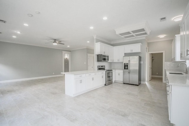 6302 Laver Love Dr, Spring, TX 77379 - kitchen with appliances with stainless steel finishes, crown molding, light countertops, a ceiling fan, and open floor plan