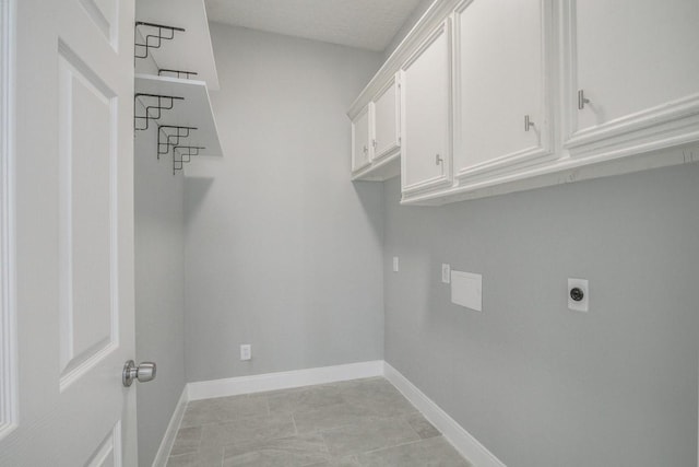 6302 Laver Love Dr, Spring, TX 77379 - washroom featuring hookup for an electric dryer and cabinet space