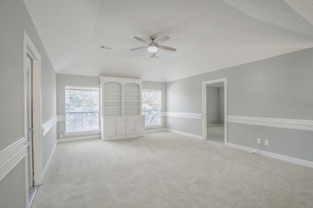 6302 Laver Love Dr, Spring, TX 77379 - empty room with lofted ceiling, ceiling fan, light colored carpet, and a textured ceiling