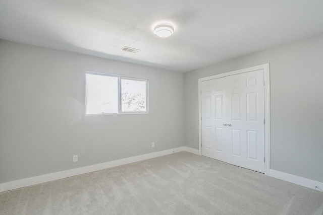 6302 Laver Love Dr, Spring, TX 77379 - unfurnished bedroom featuring light carpet and a closet