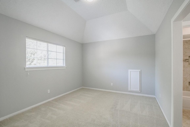 6302 Laver Love Dr, Spring, TX 77379 - spare room featuring light colored carpet and lofted ceiling