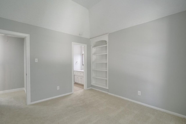 6302 Laver Love Dr, Spring, TX 77379 - unfurnished bedroom with light carpet, vaulted ceiling, and ensuite bath