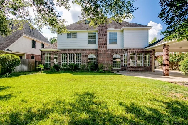 6302 Laver Love Dr, Spring, TX 77379 - back of house featuring brick siding, a patio area, and a shingled roof
