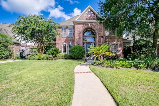 6302 Laver Love Dr, Spring, TX 77379 - view of front of house with brick siding and a front yard
