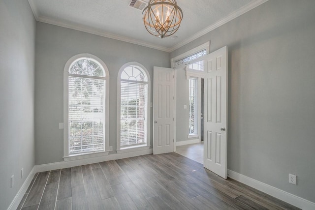 6302 Laver Love Dr, Spring, TX 77379 - empty room with a chandelier, dark wood-type flooring, and ornamental molding
