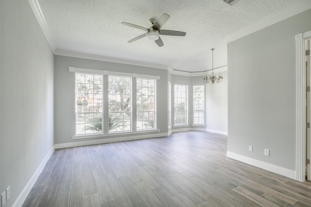 6302 Laver Love Dr, Spring, TX 77379 - unfurnished room featuring ceiling fan, a chandelier, wood finished floors, a textured ceiling, and crown molding