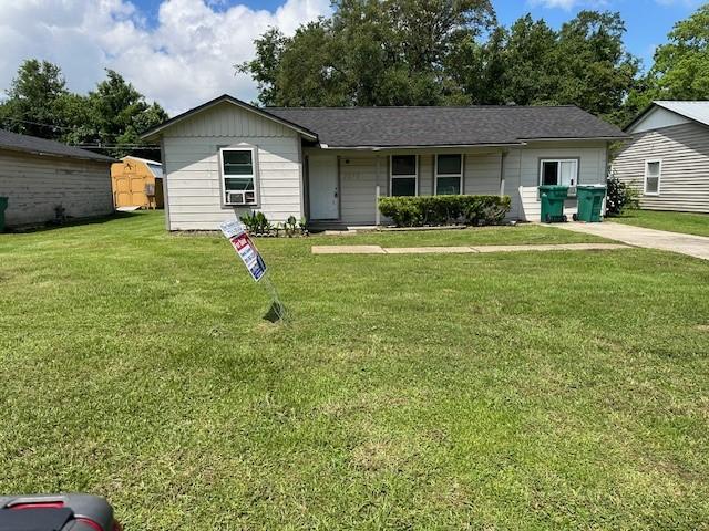 2227 Westway St, Orange, TX 77630 - ranch-style home with a front lawn