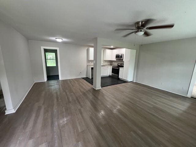 2227 Westway St, Orange, TX 77630 - unfurnished living room with dark wood-type flooring and ceiling fan