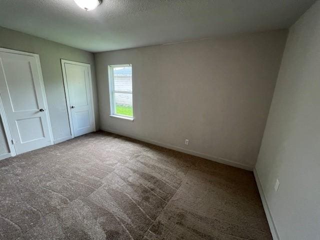 2227 Westway St, Orange, TX 77630 - unfurnished bedroom featuring carpet and a textured ceiling