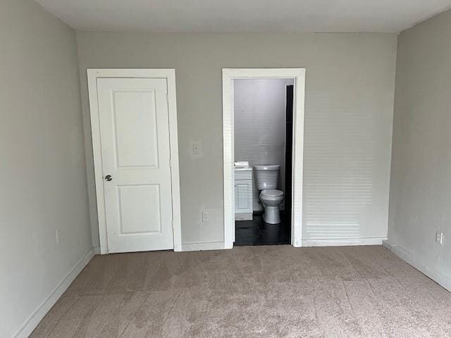 2227 Westway St, Orange, TX 77630 - unfurnished bedroom featuring carpet flooring and connected bathroom