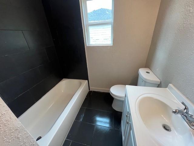 2227 Westway St, Orange, TX 77630 - bathroom featuring vanity, tile patterned flooring, and a textured wall